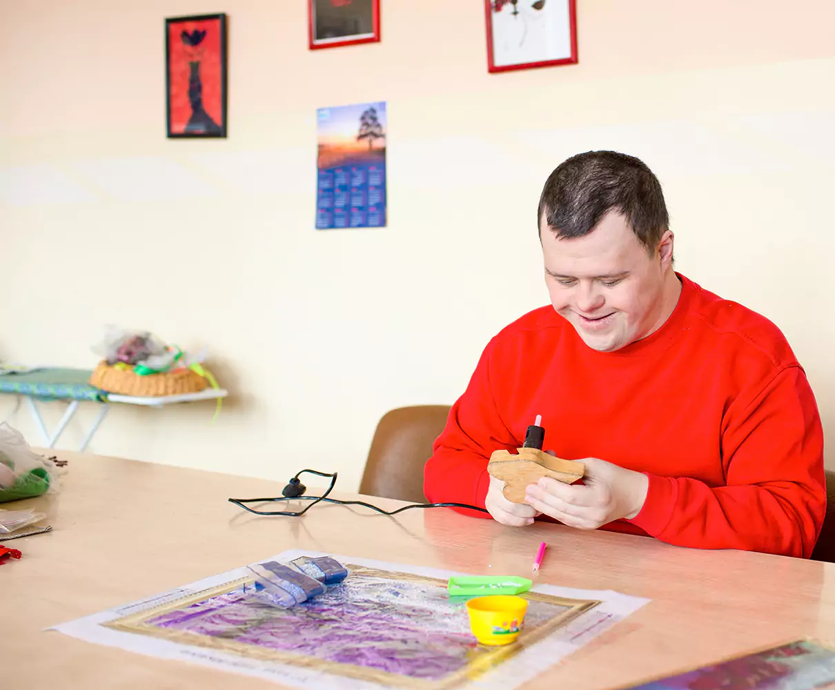 Disabled man in arts and crafts class